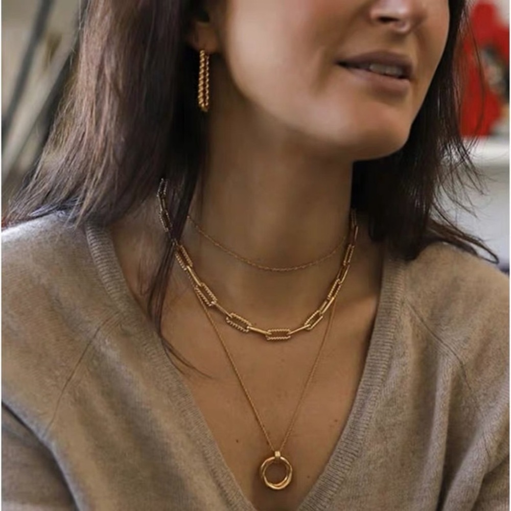 Gold helical ovate hoop earrings